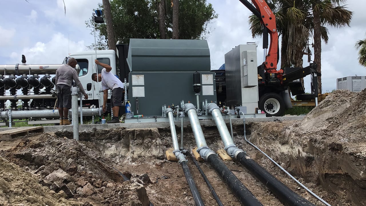 Irrigation pump station installation pipe connection workers