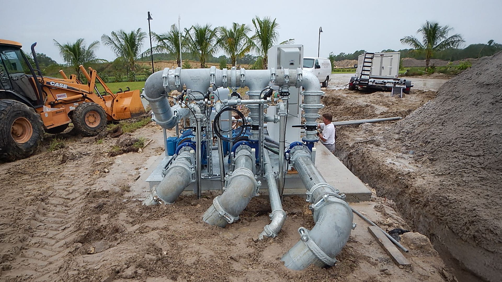 Pump station pipes getting installed into the ground