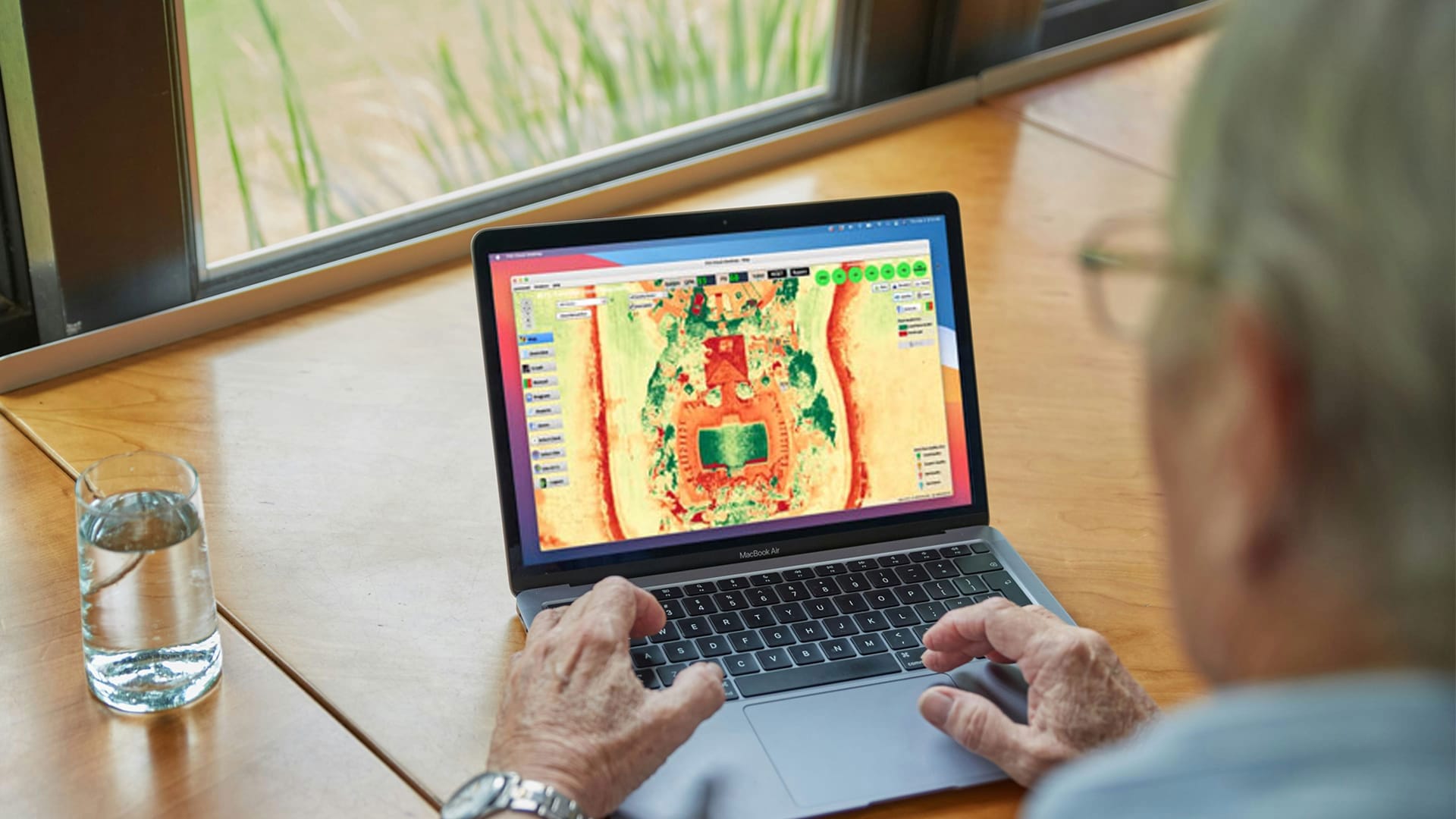 Man on laptop using Hoover Flowguard