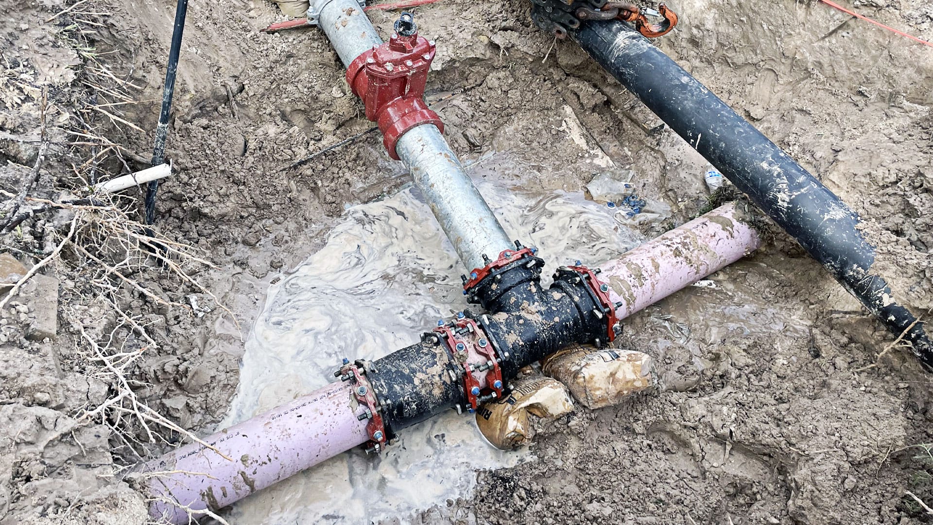 Ground work showing pipes within a trench