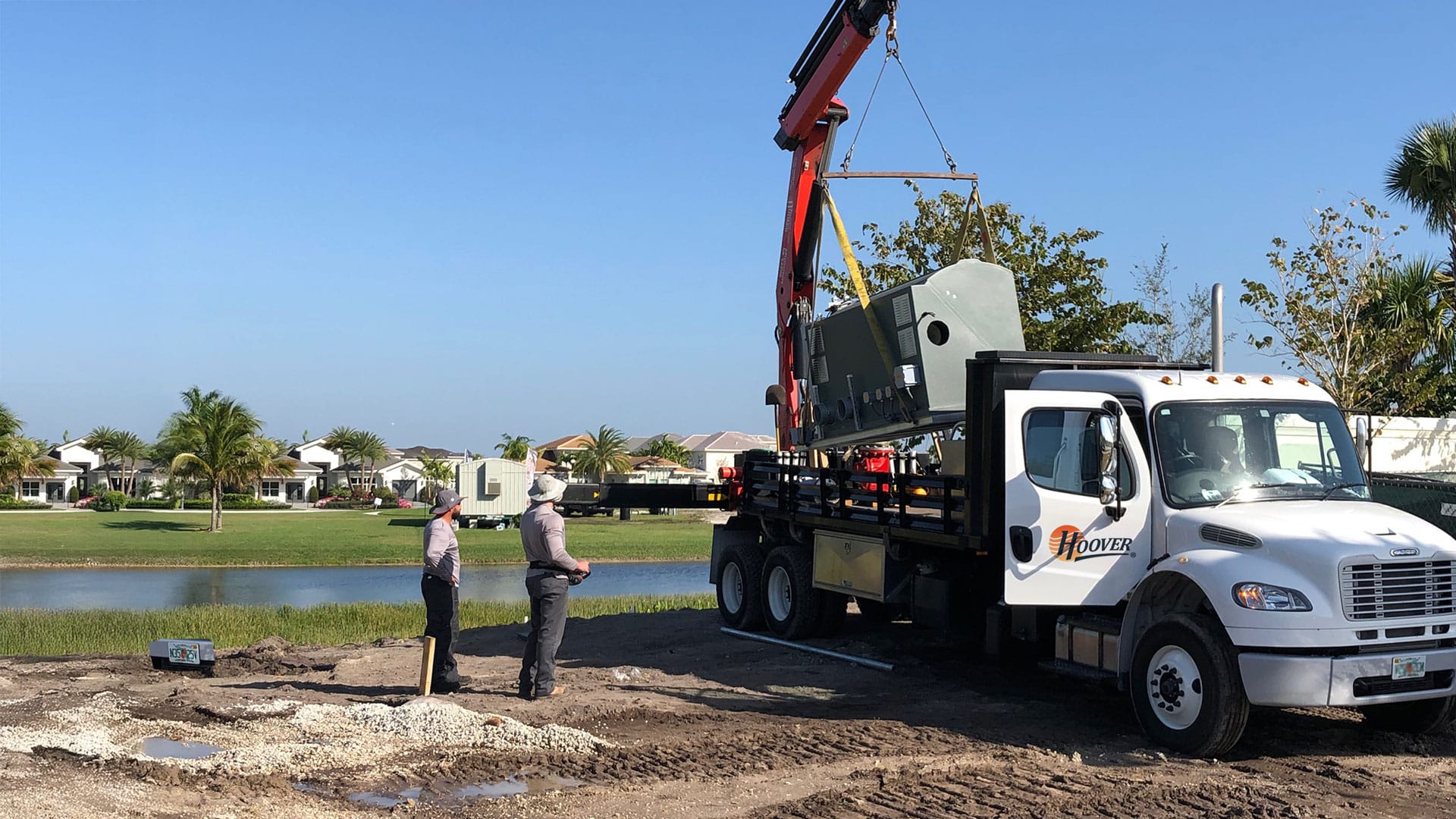 Hoover team unloading a pump station of a truck