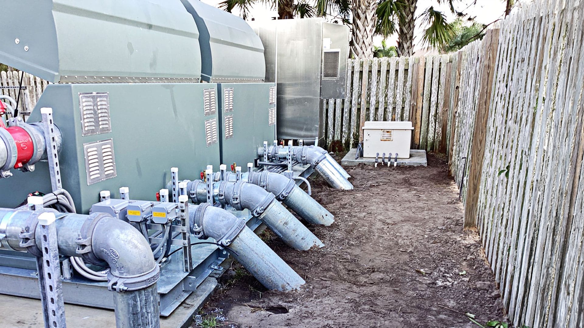 The rear of a Hoover Pump station showing pipes going into the ground