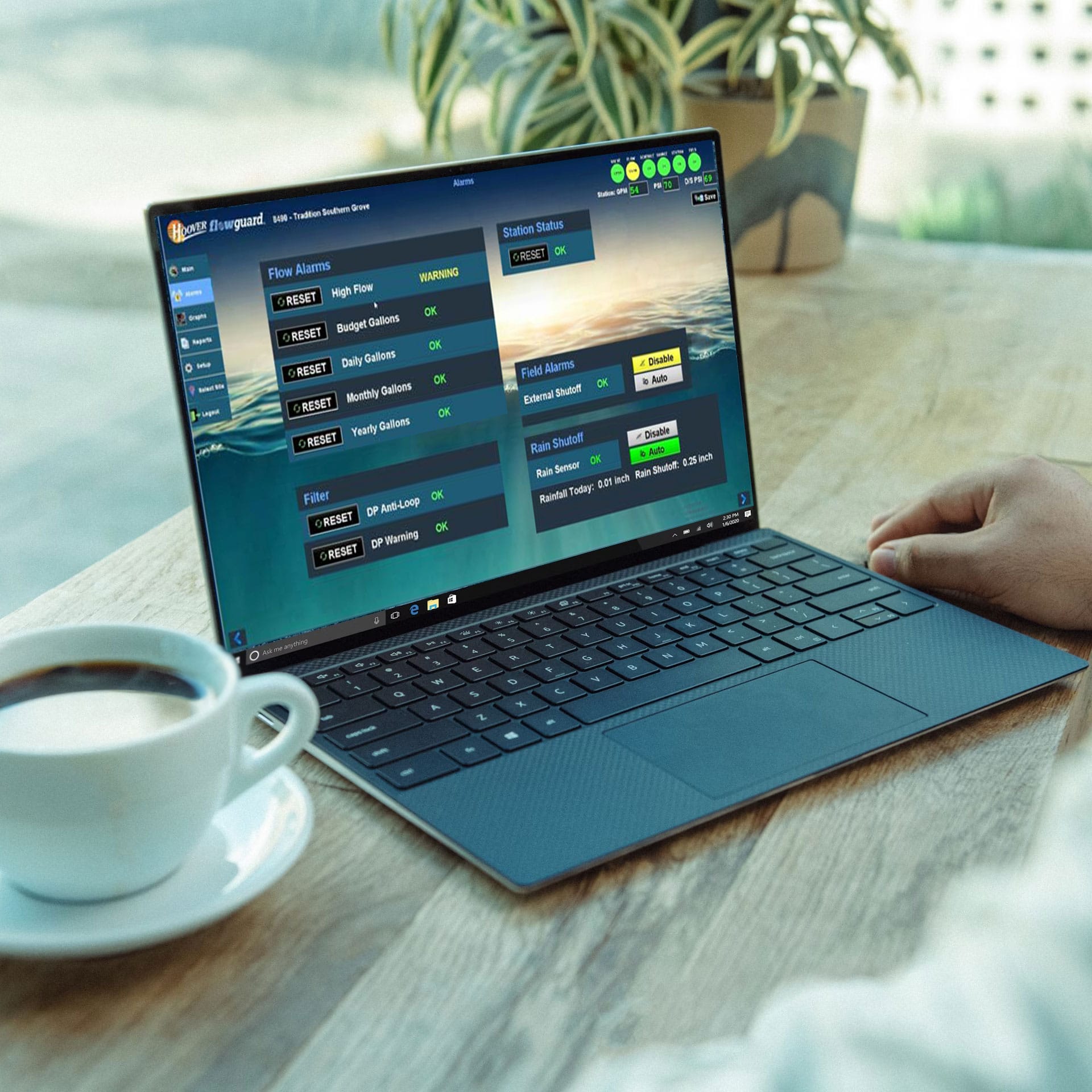 Flowguard app being used on a laptop with a cup of coffee