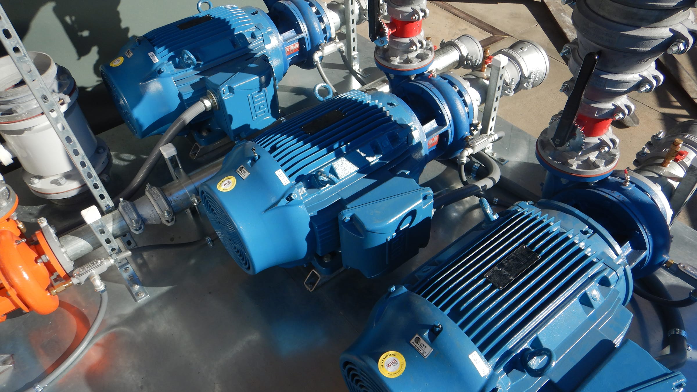 Close up of blue irrigation pump parts