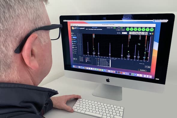 A man using the Flowguard system on a monitor
