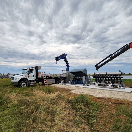 The Hoover truck and crane installing an Irrigation Pump Station
